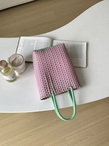Handmade PVC woven handbag in pink and green checkerboard pattern for summer vacations