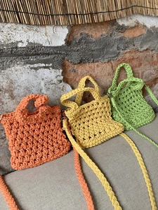 Handwoven mini crossbody bags in vibrant orange, yellow, and green cotton rope texture