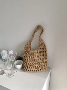 Close-up of the woven hollow texture and craftsmanship on this beach tote bag