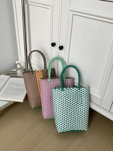 Detailed trio of colorful PVC handmade woven basket tote bags in vibrant summer patterns