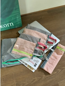 Portable mesh organizer bag set for travel and stationery storage with colorful zippers