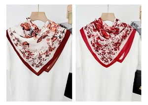 Detail view of retro butterfly print square scarves with vibrant red borders