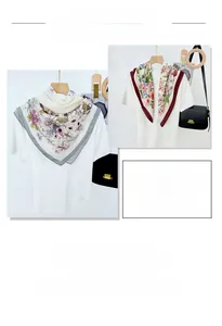 Detail of vibrant floral print silk scarves with soft texture and elegant draped finish