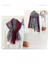 Detail shot of long paisley pattern scarf with elegant burgundy and grey gradient finish