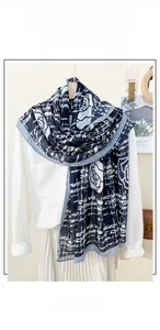 Detail of blue and white grid scarf with white rose pattern in cotton and linen blend