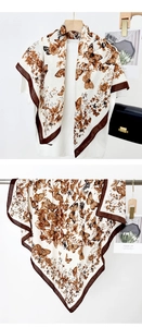 Detail of vintage butterfly print square scarf showing drape and flat floral pattern design