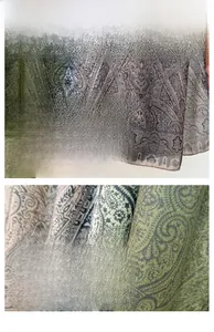 Detailed macro view of paisley pattern and fine edge stitching on gradient silk scarf