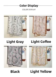 Detail of geometric mandala print scarves in light grey, brown, black and yellow tones