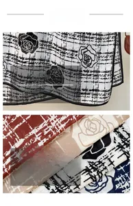 Close-up of rose flower print and plaid pattern on lightweight breathable fabric scarf
