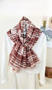 Retro reddish-brown scarf with white rose floral patterns and abstract grid textures
