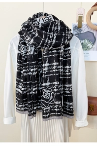 Detailed shot of black and white lattice rose scarf with thin breathable fabric texture