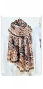 Detail shot of ethnic paisley pattern on a soft cotton linen scarf for women