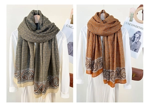 Detail of bohemian paisley print scarves in teal and caramel on white shirts