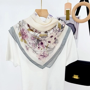 Floral print silk neck scarf in beige and purple shown as a stylish accessory