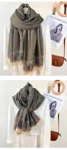 Detail of olive green chain and paisley print scarf styled with a white shirt