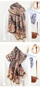 Detail of bohemian paisley print scarf showing intricate patterns and soft drape texture