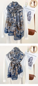 Close-up of vintage paisley pattern on a lightweight scarf styled with a white shirt