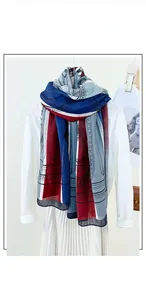 Vertical display of European style cotton and linen floral scarf on a white blouse