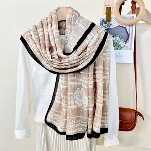 Elegant beige floral scarf with black border and rose pattern for sun protection