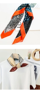 Detail view of printed silk scarves featuring classic paisley patterns and elegant styling