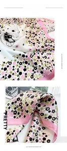 Detail of floral horse carriage print scarf with pink borders and soft texture