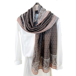Retro paisley chain print long scarf in coffee and brown hues over white shirt