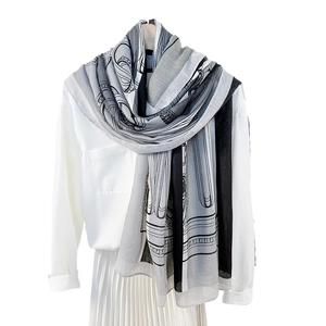 European style lightweight scarf with architectural print shown on a model outfit