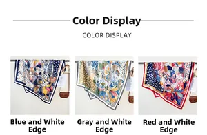 Silk square scarf color display in blue, grey, and red patterns on metal hooks