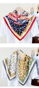 Detail of silk-like 90cm square scarves showing colorful floral prints and rolled edges