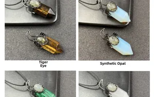 Macro view of hexagonal gemstone pendants including tiger eye and opal on dark surface