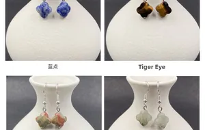 Detail view of four-leaf clover drop earrings featuring natural semi-precious gemstones