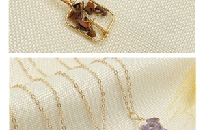 Detailed wire-wrapped crystal heart pendant featuring natural tiger eye and amethyst stones