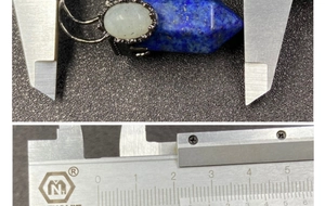 Macro view of blue hexagonal crystal pendant with moonstone showing 35mm measurement