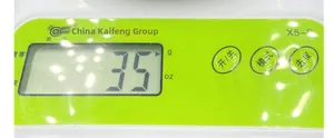 Macro shot of X5-S digital kitchen scale display and green control buttons in detail