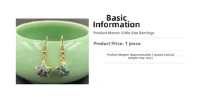 Detail view of star-shaped crystal earrings with gold trim and natural green-red stone texture