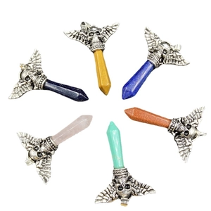 Set of six punk gothic crystal pendants featuring skulls and wings on polished stones