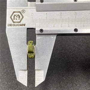 Macro shot of 8mm hexagonal natural green agate cross bead measured with a digital caliper