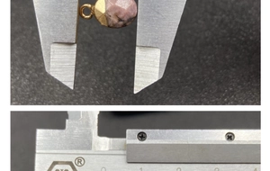 Detail view of faceted semi-precious stone pendant with gold bezel measuring 1 cm width