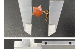 Measurement of star-shaped strawberry quartz earring width using a digital caliper tool