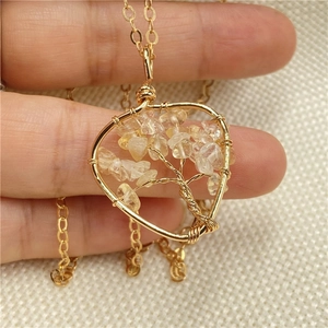 Handmade gold tree of life necklace with yellow crystal stones on a long cable chain