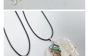 Detail of elephant pendant with white mother of pearl and colorful abalone shell