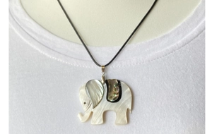 Detail of elephant pendant featuring white mother of pearl and iridescent abalone shell