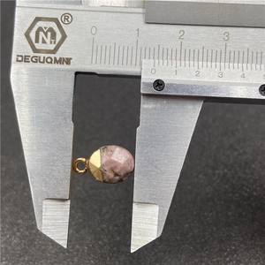 Faceted pink natural stone pendant with gold bezel and 10mm width measurement scale
