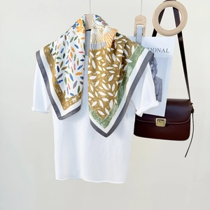 Elegant multi-color printed silk square scarf with abstract leaf patterns and geometric textures