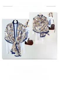 Detail of vintage paisley print cotton linen shawl with navy blue border and boho pattern