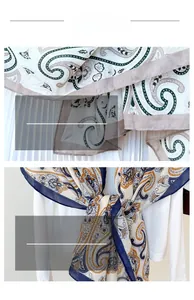 Close-up of paisley pattern cotton linen shawl showing fine stitching and soft texture