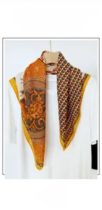 Detail of vintage horse print square scarf in cotton linen blend draped over a white tee