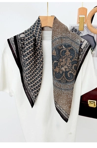 Detail of silk-like square scarf featuring horse prints and houndstooth pattern