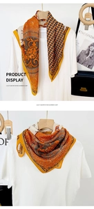 Detail view of horse and chain equestrian print on orange vintage square scarf