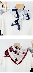 Detail of camellia print scarf in navy and wine red with elegant silk-like texture